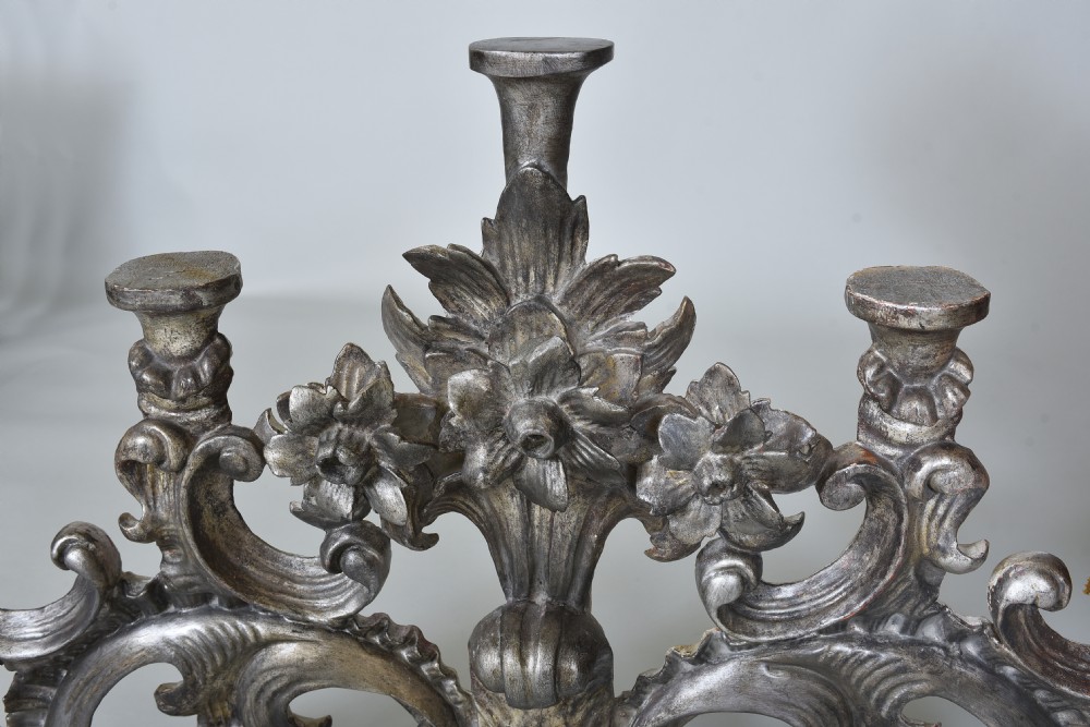 An 18th-century Italian carved wooden pediment finished in aged silver leaf featuring floral motifs, acanthus scrollwork, and raised pedestals. View III