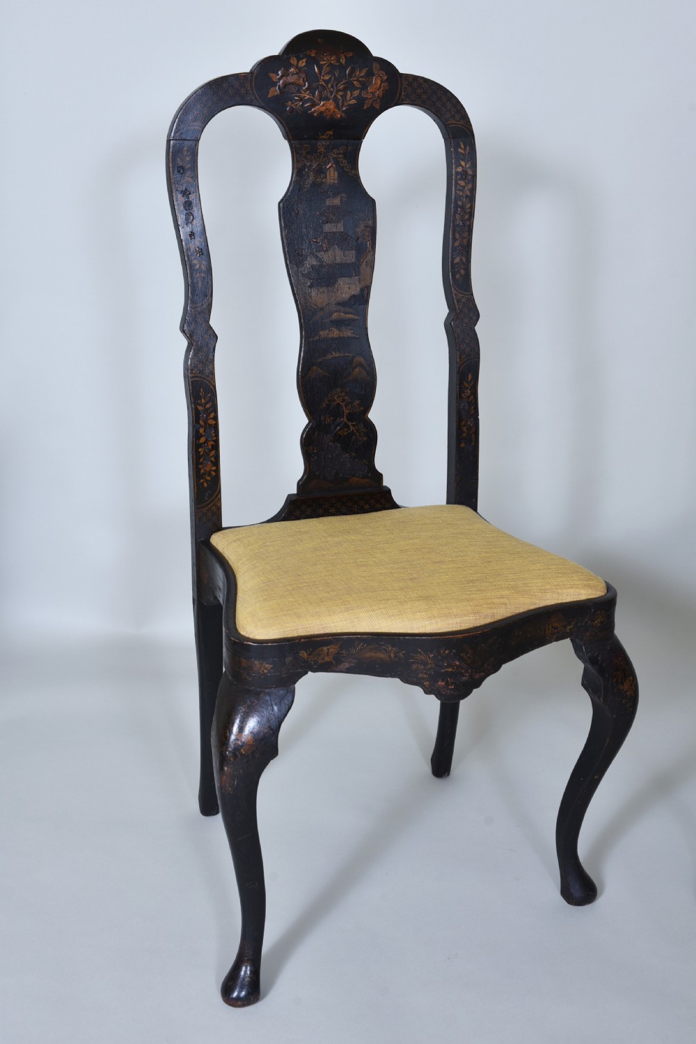 A pair of black lacquered Queen Anne style side chairs featuring vasiform splats, hand-painted gold Chinoiserie patterns, cabriole front legs, and yellow upholstered drop-in seats. View II