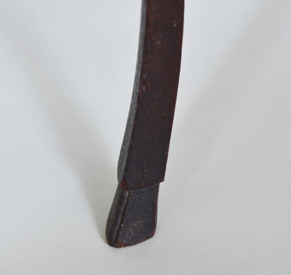 An 18th-century dark oak side table featuring curved cabriole legs, a scalloped apron, and a raised two-tier scalloped gallery shelf. View VII