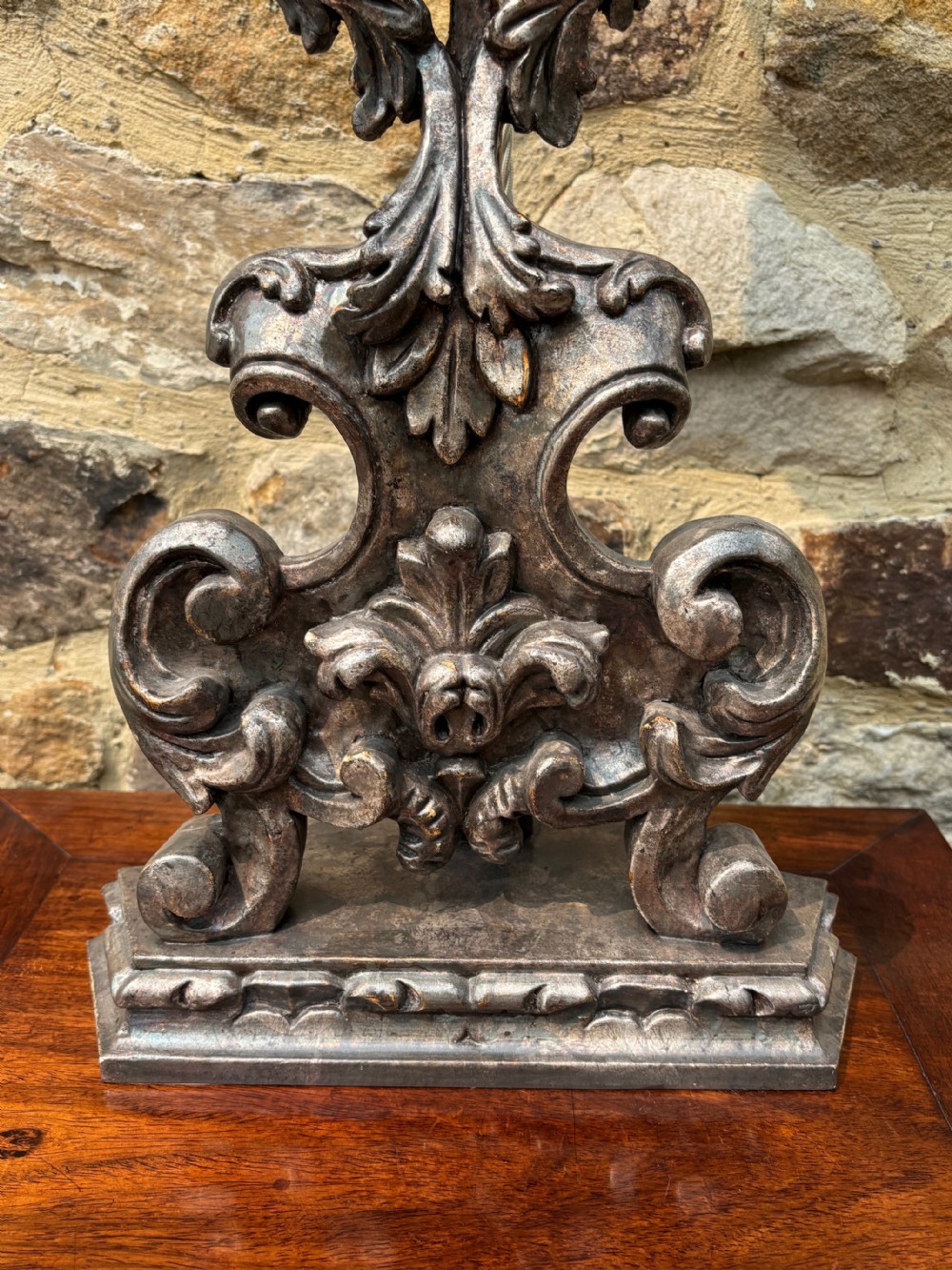 A tall, hand-carved wooden lamp base featuring Baroque scrollwork and an antiqued silver leaf finish. View VII