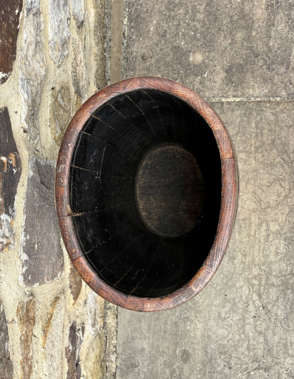 A 19th-century coopered oak barrel stick stand featuring brass hoops and a hand-painted crest on the front. View VI