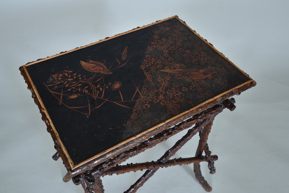A small rectangular side table constructed from dark brown natural twigs and branches with a smooth lacquered top surface. View IV