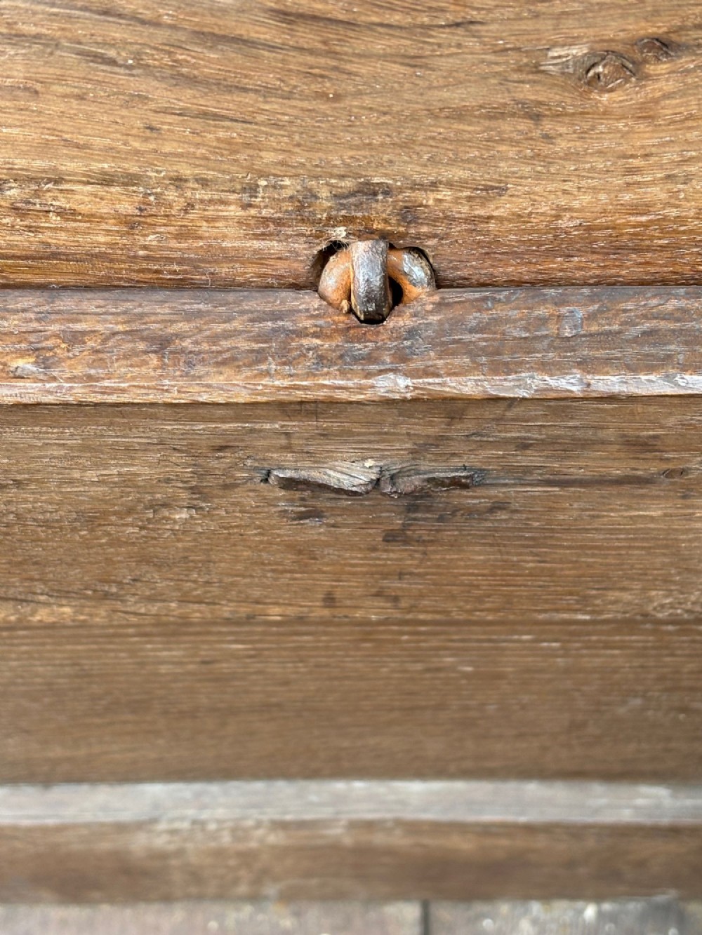 A 17th-century oak coffer featuring a hinged lid, panelled front, and geometric marquetry inlay. View VII