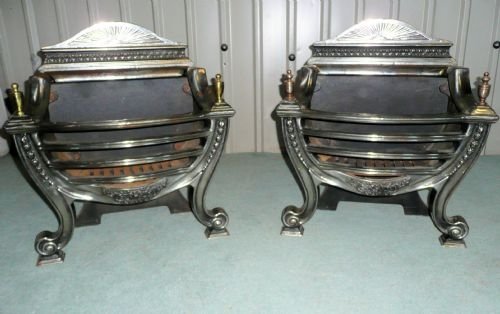 A Pair of Polished Steel Cast Iron Fire Grates