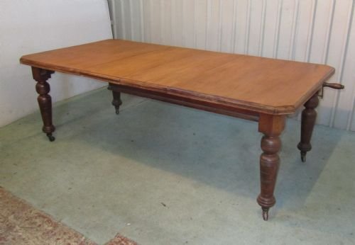fig 1. LARGE BLONDE MAHOGANY WIND OUT EXTENDING TABLE