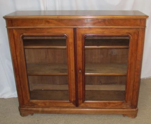 A French 19th Century Figured Walnut Glazed Bookcase.