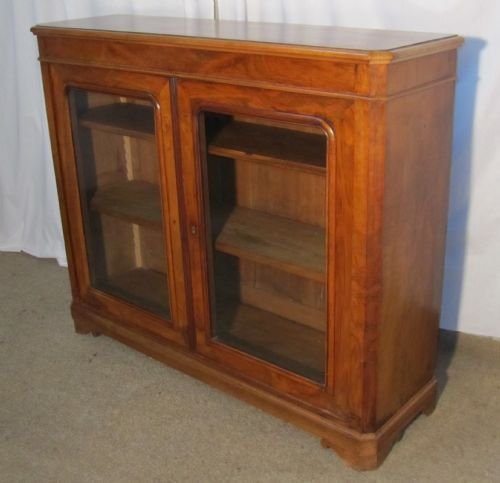 fig 1. A French 19th Century Figured Walnut Glazed Bookcase.