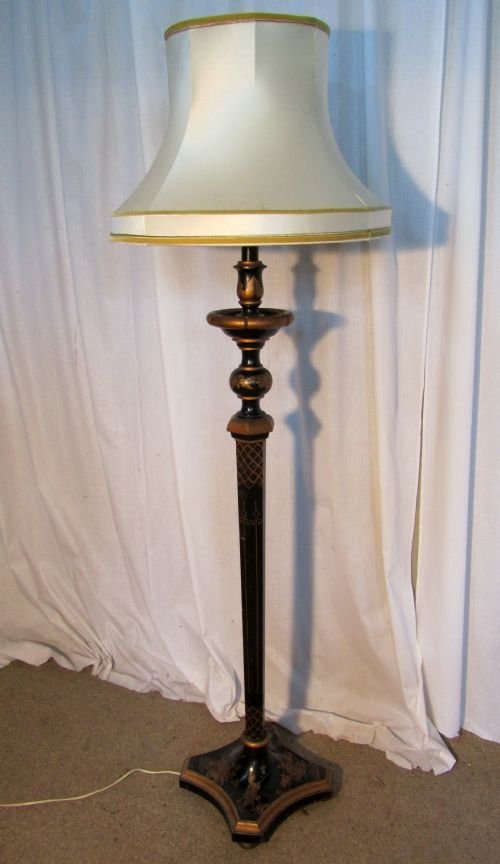 A Black Lacquer and Gold Floor Standing Lamp