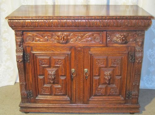 A Richly Carved Victorian Pussy Oak or Green Man Sideboard