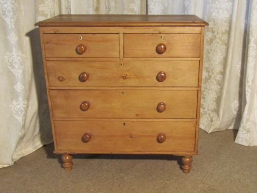 A Large Victorian Stripped Pine Chest of Drawers