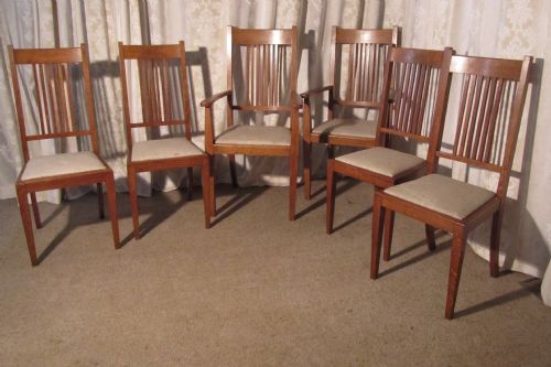 A Set of Six Arts & Crafts Golden Oak Dining Chairs by Heals