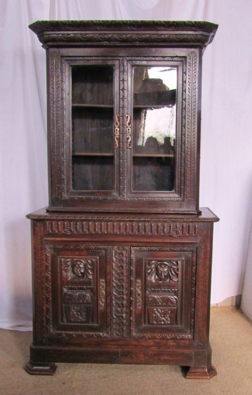 French Gothic Green Man Carved Oak Game Cupboard Bookcase