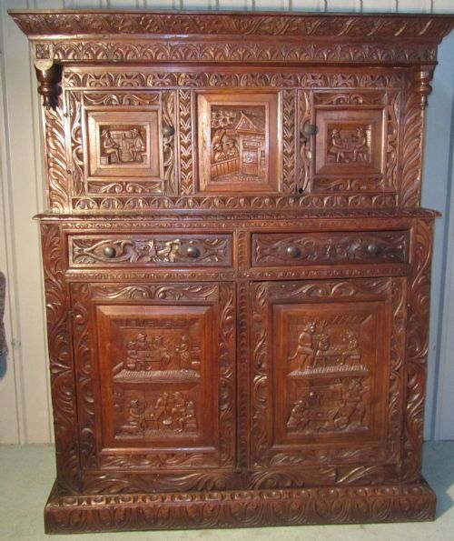 A Very Unusual 17th Century Green Man Carved Oak Court Cupboard
