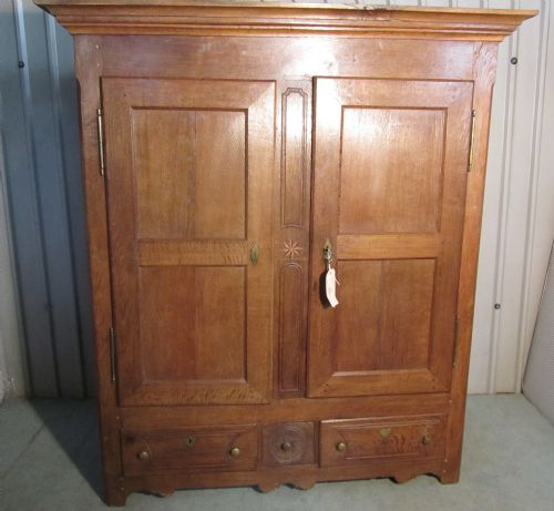 A Large and Heavy German Oak Bookcase or Housekeepers Cupboard