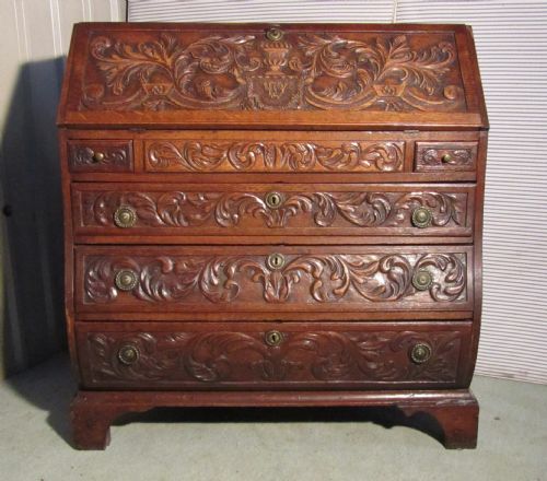 A Very Rare Early Victorian Carved Oak Bombé Bureau