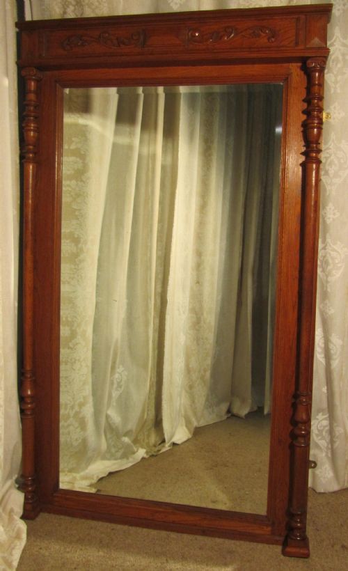 A Very Large French Carved Oak Wall Mirror