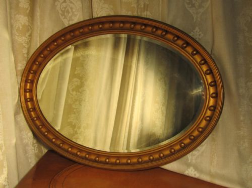 A Large Regency Style Oval Gilt Wall Mirror