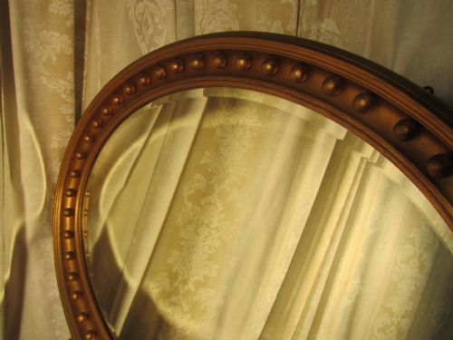 fig 1. A Large Regency Style Oval Gilt Wall Mirror