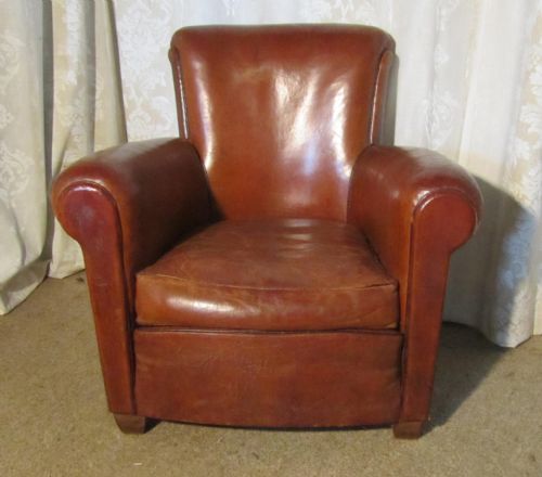 An Elegant French Club Arm Chair, in Brown Leather with Brass Studs