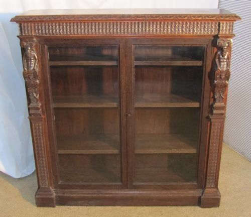 A Victorian Green Man Gothic Oak 2 Door Bookcase.