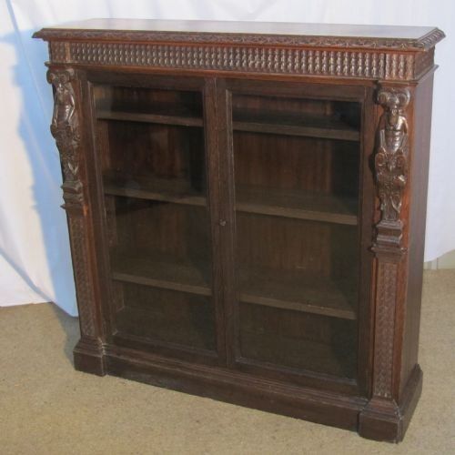 fig 1. A Victorian Green Man Gothic Oak 2 Door Bookcase.