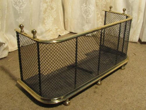 A Victorian Brass and Iron Club Fender