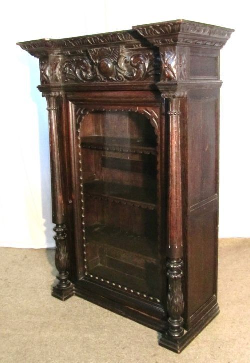 fig 1. A Tall Glazed French Carved Oak Bookcase