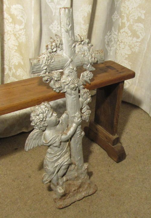 A Small French Cast Iron Cross with Cherub