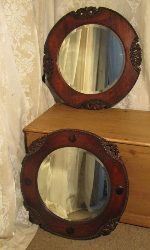 A Near Pair of Art Deco Round Oak Mirrors