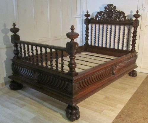 A Heavily Carved French Oak Small Double Bed