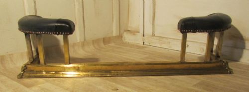 A Victorian Brass and Leather Club Fender