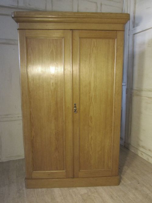 A Victorian Stripped Pine Wardrobe Compactum