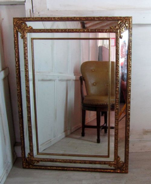 A Large French Gilded Brass Cushion Mirror