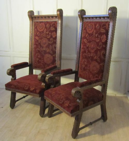 A  Pair of Very Large French Arts and Crafts Carved Oak Throne Chairs.