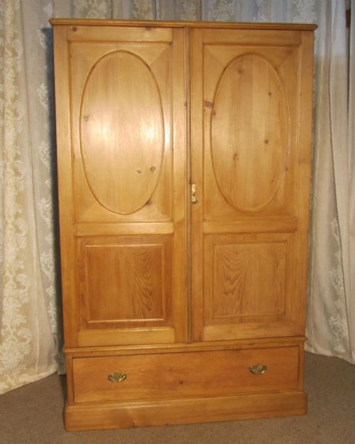 An English Victorian Stripped Pine Wardrobe Compactum