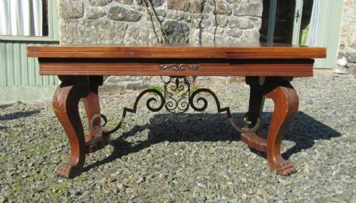 A Large 19th Century Carved and Parquetry Oak Draw Leaf Table