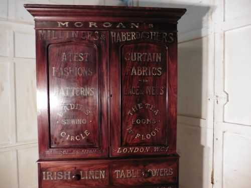 fig 1. A Victorian Flame Mahogany Linen Press from a Haberdashery or Drapers Shop Display