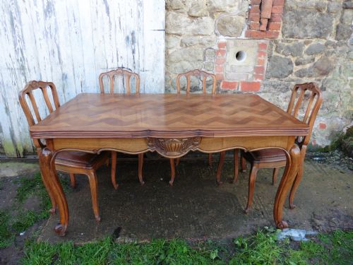 A Large French Parquetry Draw Leaf Table and 6 Chairs