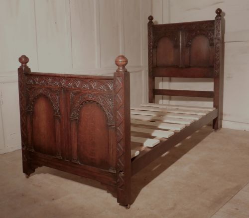 A Superb Victorian Gothic Carved Oak Single Bed