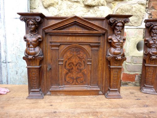 Carved and Inlaid Oak Door Panel, with Caryatid Guardians