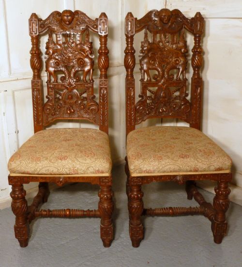 A Pair of Welsh Gothic Carved Oak Hall Chairs