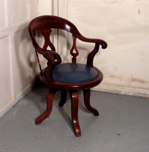 A Swivelling Mahogany Office Chair or Desk Chair