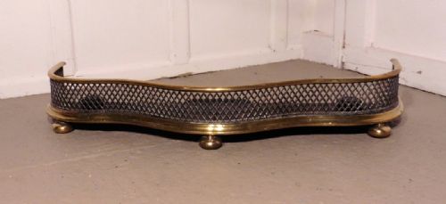 A Superb Quality Serpentine Victorian Brass and Iron Fender