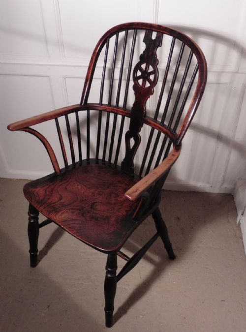 A Georgian Elm and Yew Wheel Back Windsor Carver Chair
