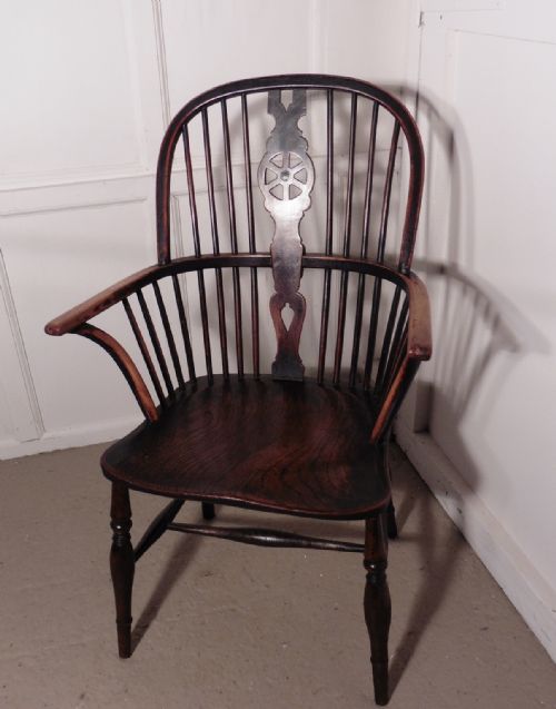 A Georgian Elm and Ash Wheel Back Windsor Carver Chair