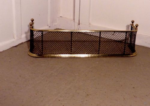 A Victorian Brass and Iron Club Fender