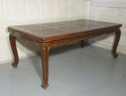 A Large French Oak Draw Leaf Table