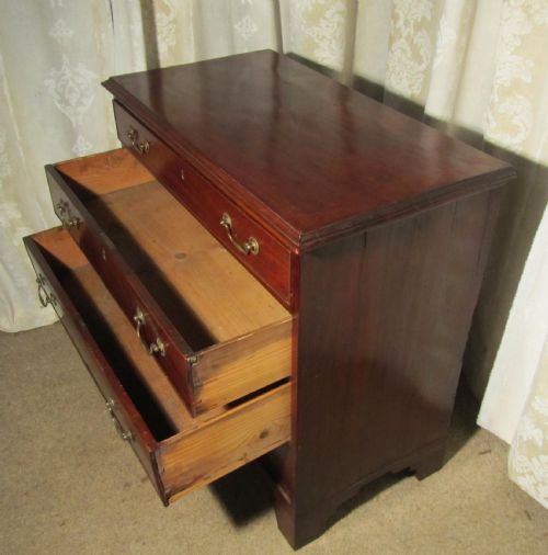 fig 2. A Small Georgian Flame Mahogany Chest of Drawers