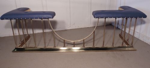A Superb Very Large Brass and Leather Club Fender