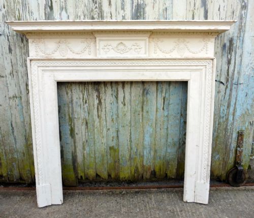 A Large Victorian Painted Pine Fireplace.